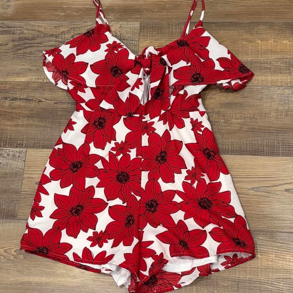 Red floral romper ruffle top with adjustable straps and peek a boo tie front